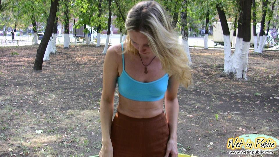 Blonde addicted to public pissing makes her pants all wet in a park #78595373