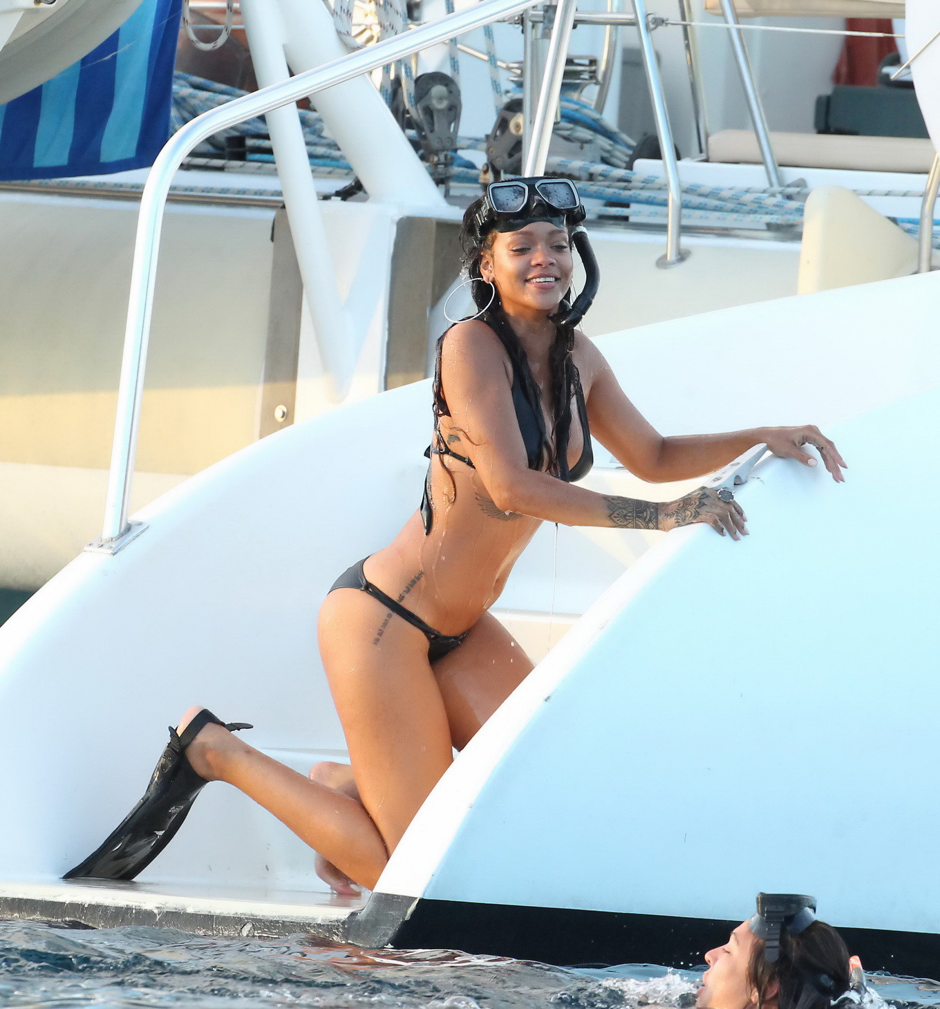 Rihanna shows off her perfect butt in a skimpy black bikini on the yacht in Barb #75185560