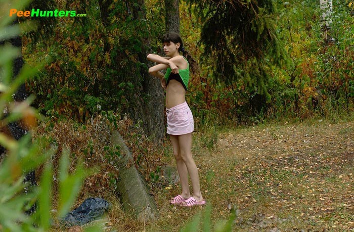 Little babe takes a leak in the nearby bushes #78690744