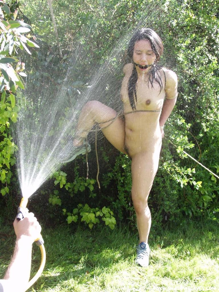 Oriental slave tied up outside and hosed down #72212934