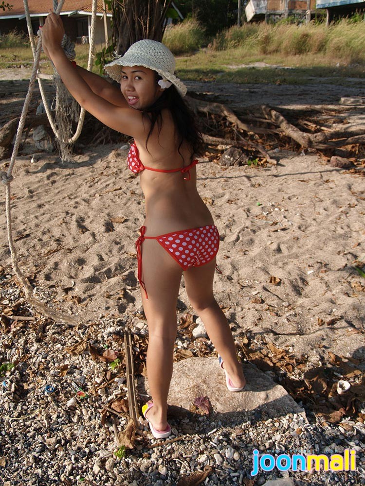 Thai girl in bikini outdoors #69969424
