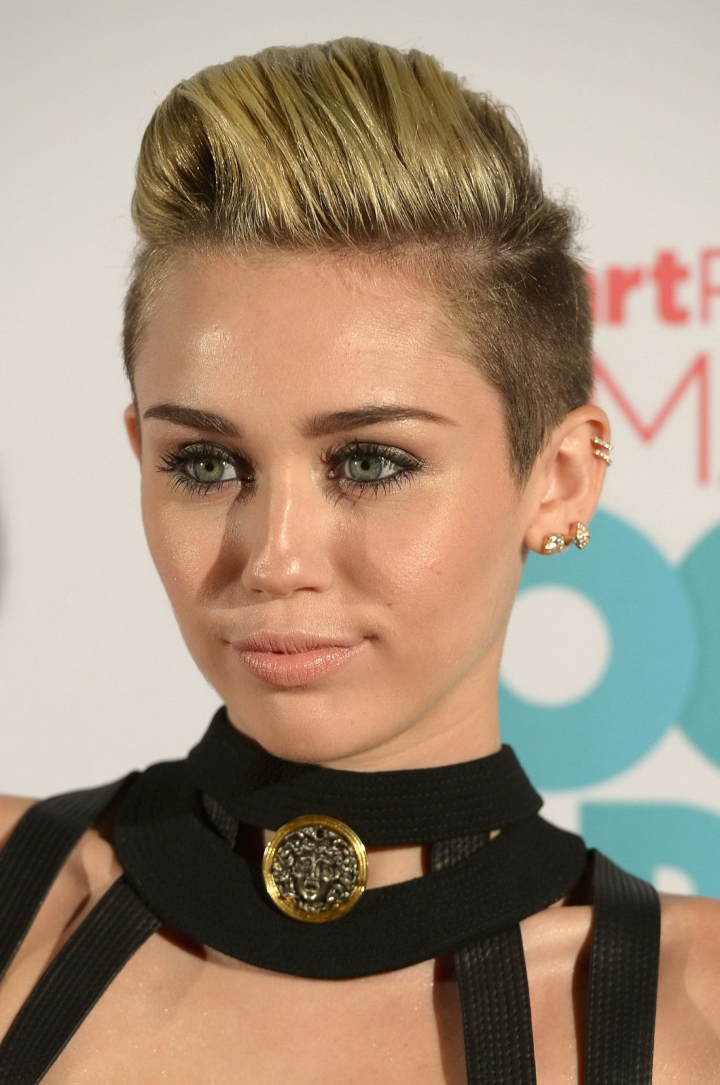 Miley Cyrus showing huge cleavage in black mikro dress at the iHeartRadio Ultima #75226818