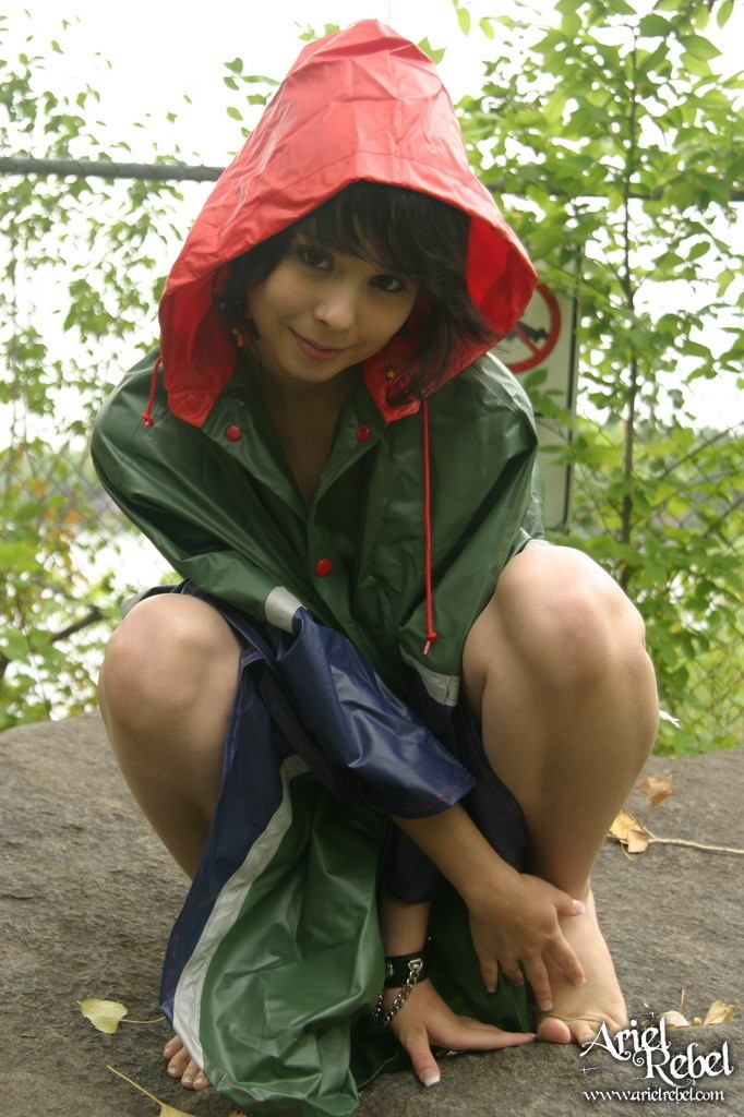 Teen plays under the rain