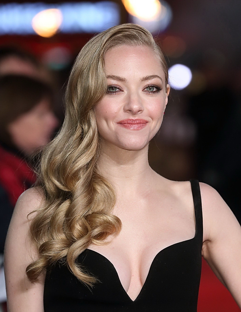 Amanda Seyfried shows off her sexy chest wearing low cut black dress at Les Mise #75246753