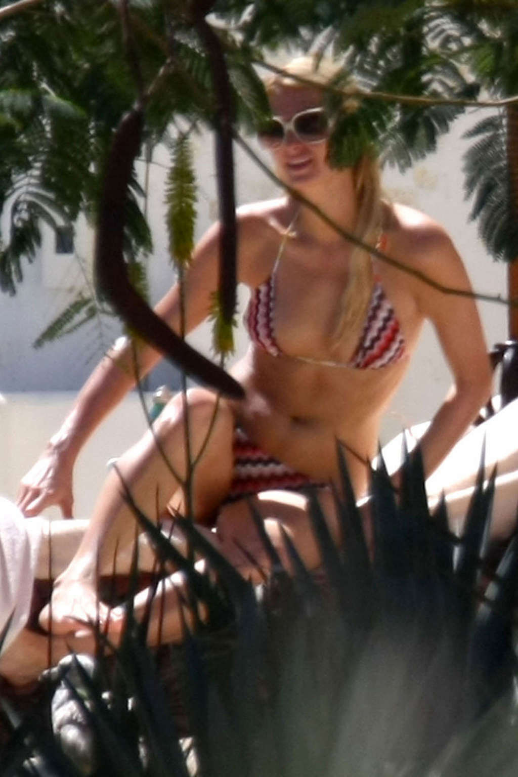Paris Hilton showing her tits on vacation on while sunbathing paparazzi shoots #75356446