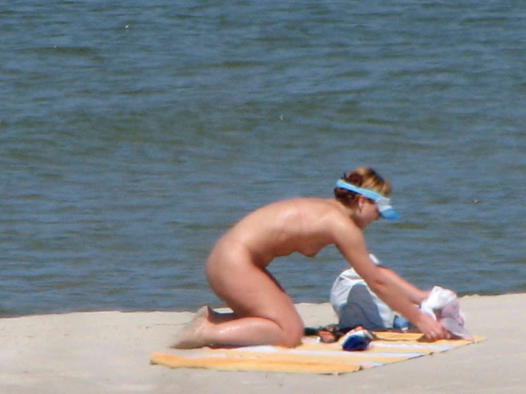 A pair of nudist teen friends steam up the beach #72253218