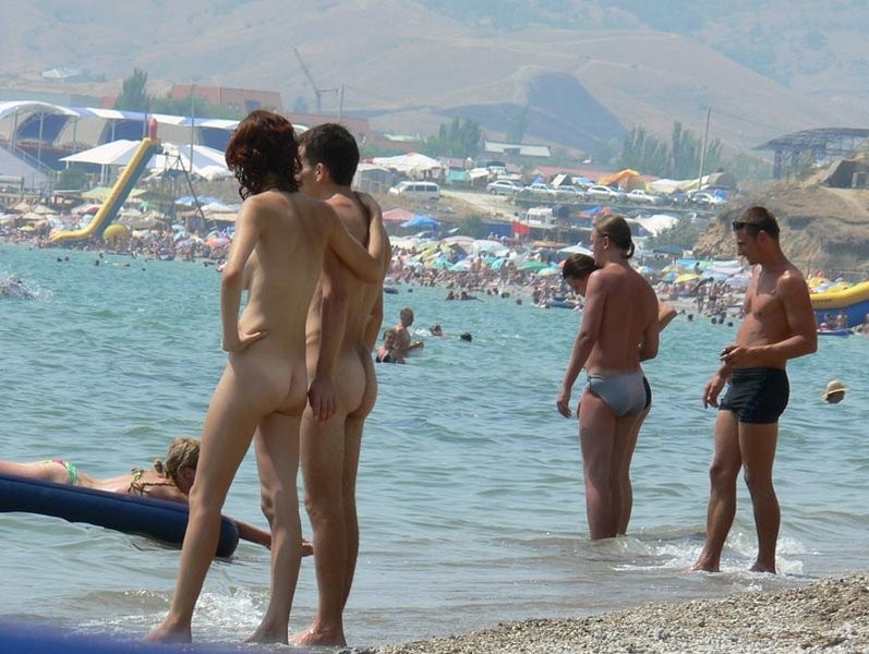 A pair of nudist teen friends steam up the beach #72253244