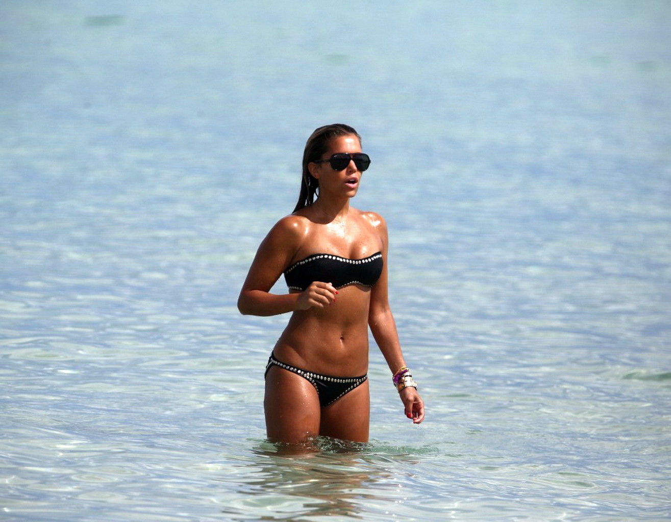 Sylvie van der Vaart wearing a black tube bikini on a beach in Miami #75216462