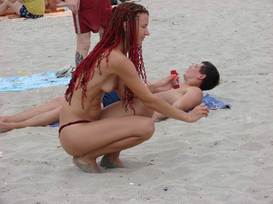 Blonde milf has some enjoyment remaining nude on a public beach #72248039