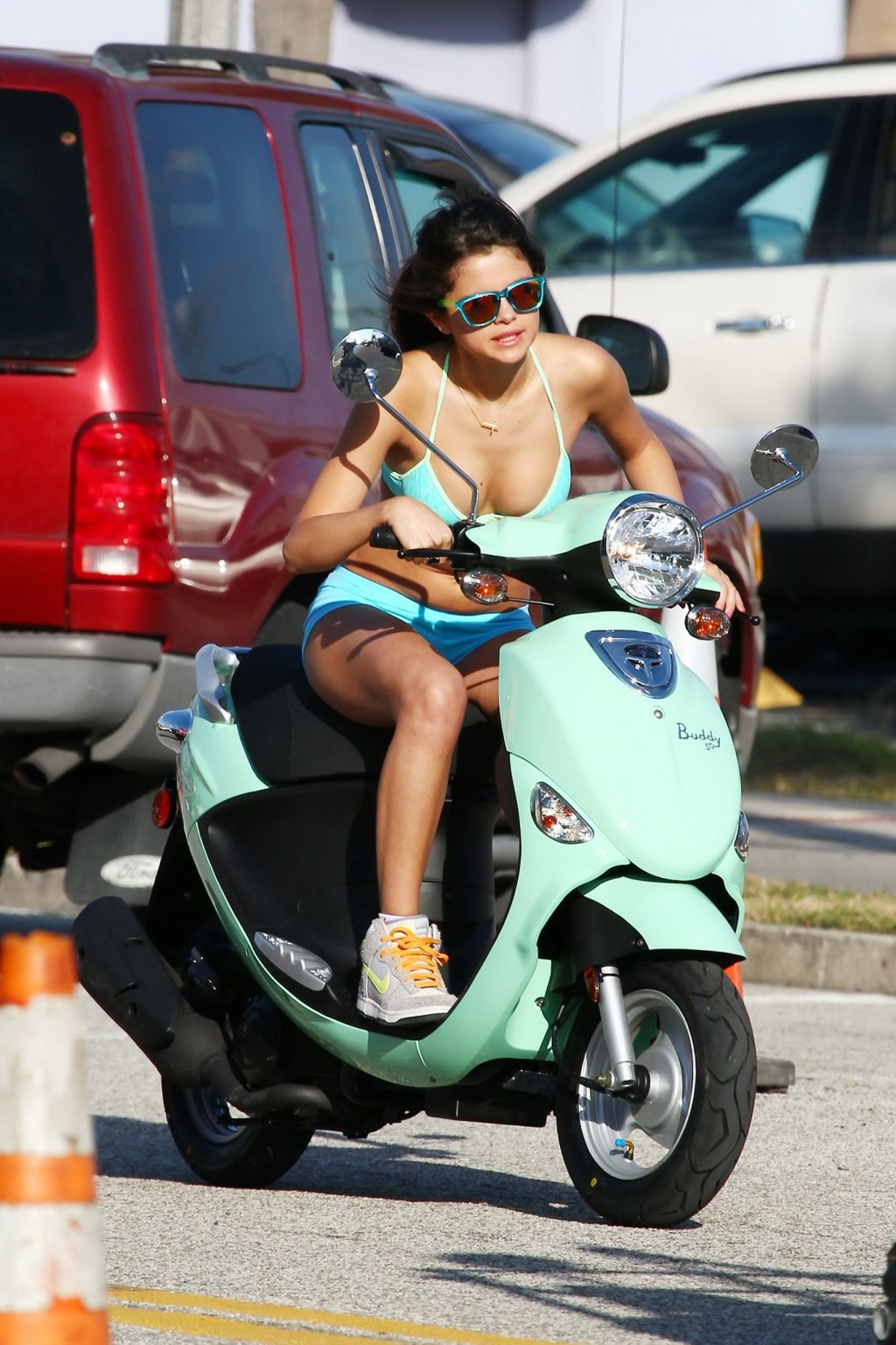 Selena Gomez in bikini top  shorts riding a scooter on 'Spring Breakers' set #75270522