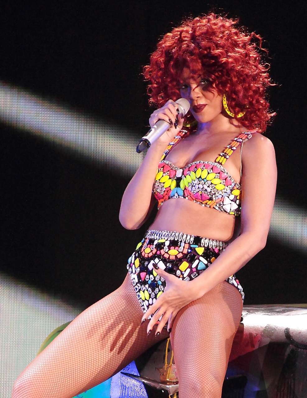 Rihanna in shorts and fishnets performing on stage paparazzi pictures #75301030