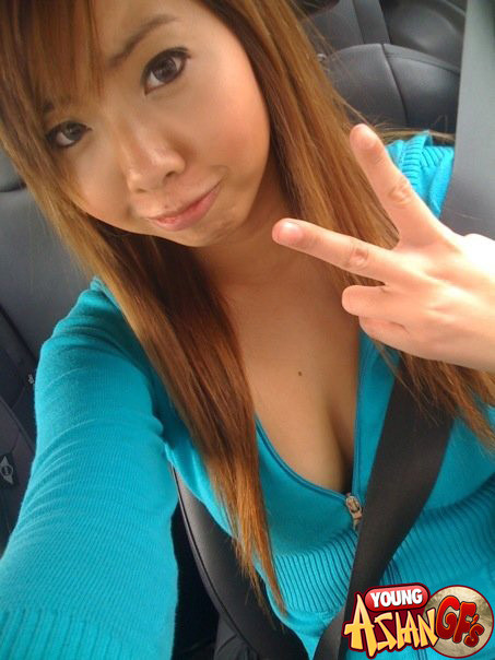 Asian girlfriends posing for cell phone pics #69919979