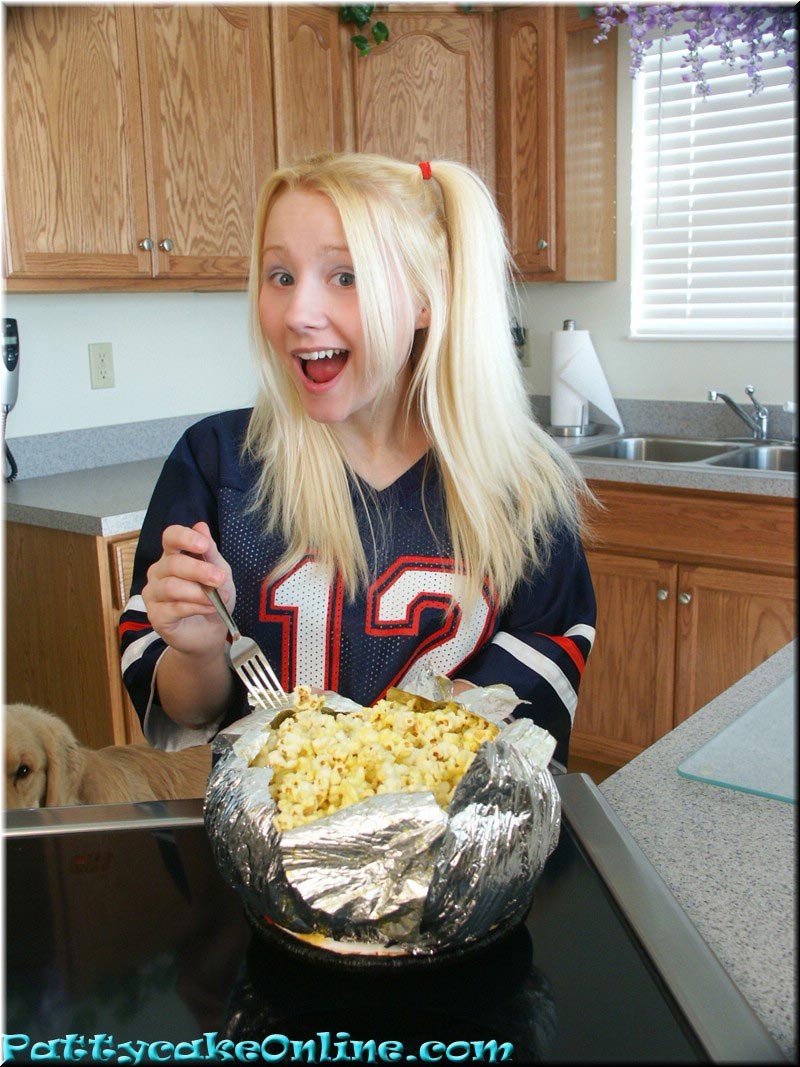 Blonde teen cheering for her football team #73984841