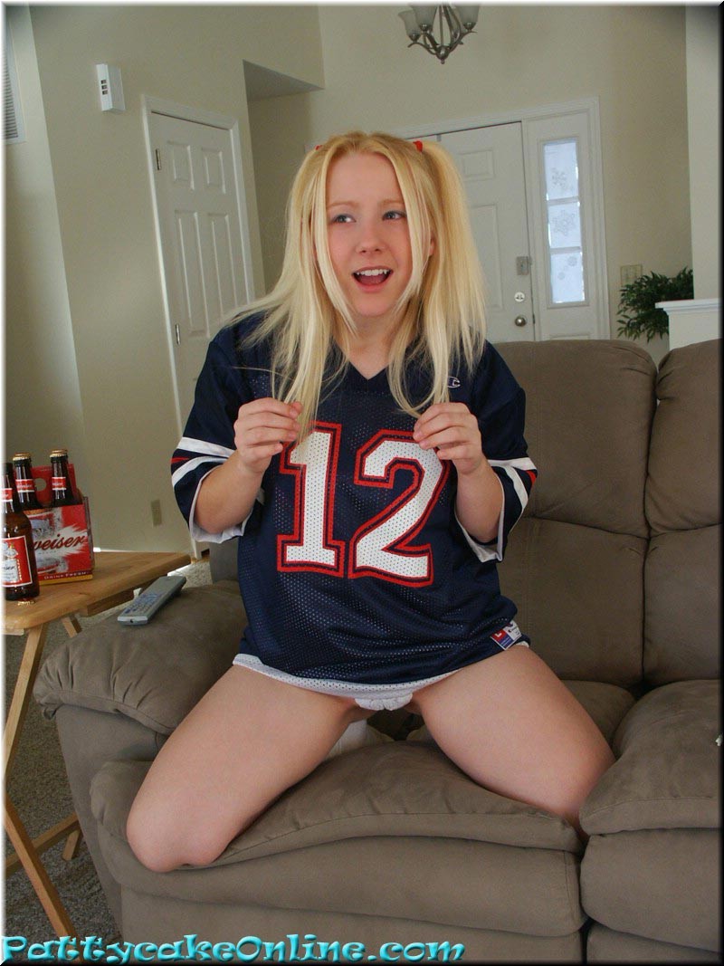 Blonde teen cheering for her football team #73984875