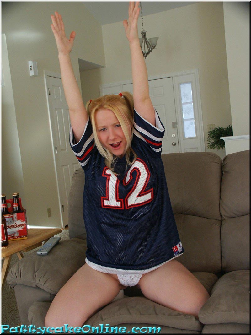 Blonde teen cheering for her football team #73984881