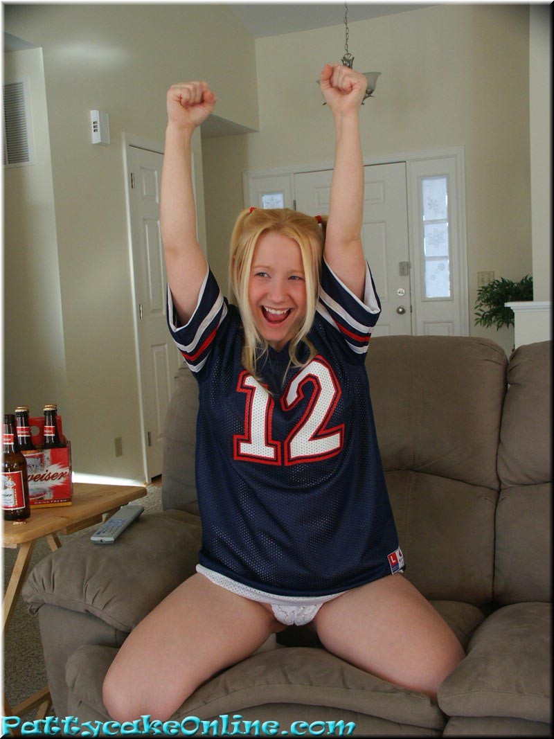 Blonde teen cheering for her football team #73984891