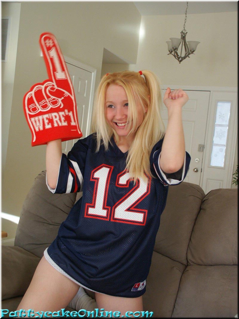 Blonde teen cheering for her football team #73984935