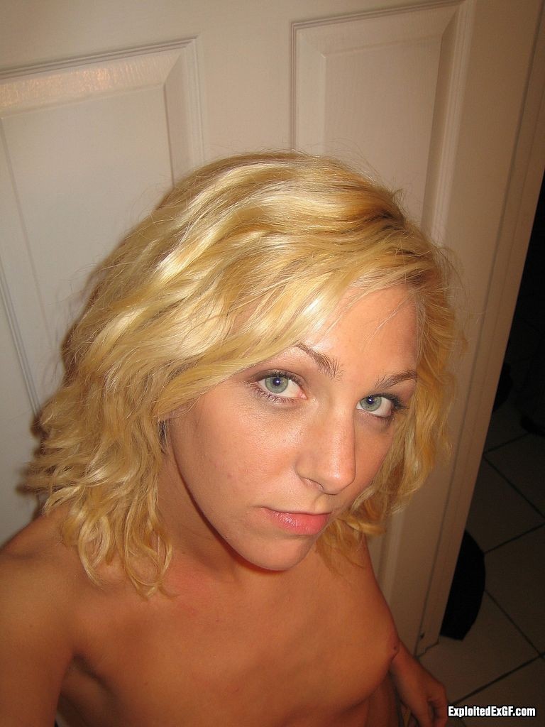 Curly blond amateur shows tiny tits