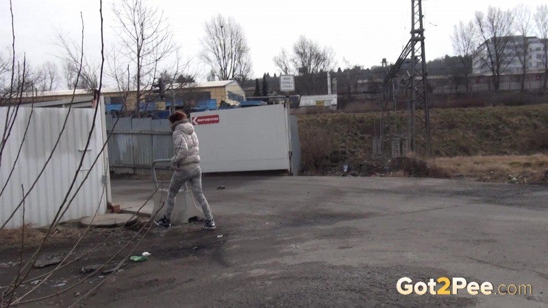 Sexy brunette pissing on an industrial estate #67493360