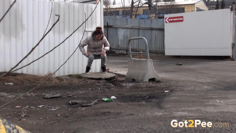 Sexy brunette pissing on an industrial estate #67493365