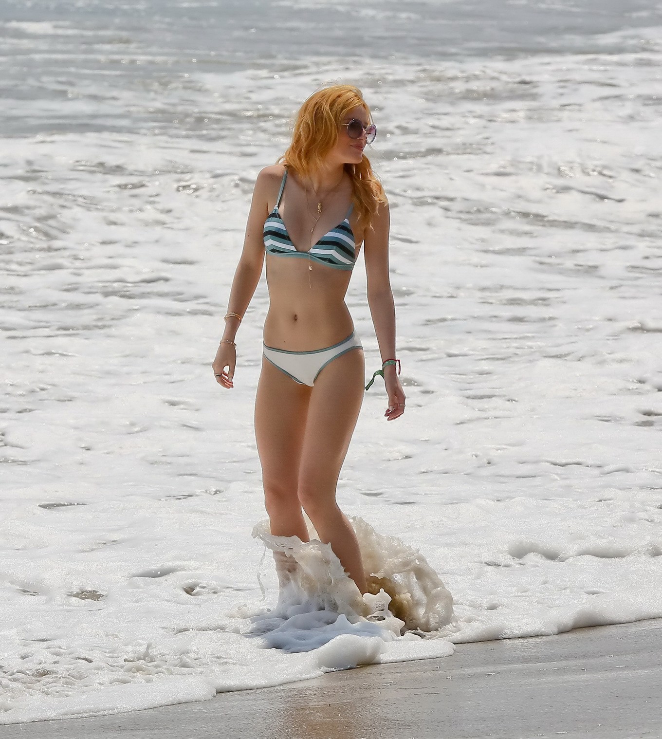 Bella Thorne stripping to bikini on the beach at Joel Silvers Memorial Day Party #75163093