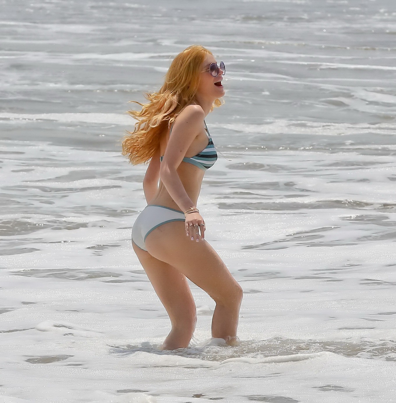 Bella Thorne stripping to bikini on the beach at Joel Silvers Memorial Day Party #75163101