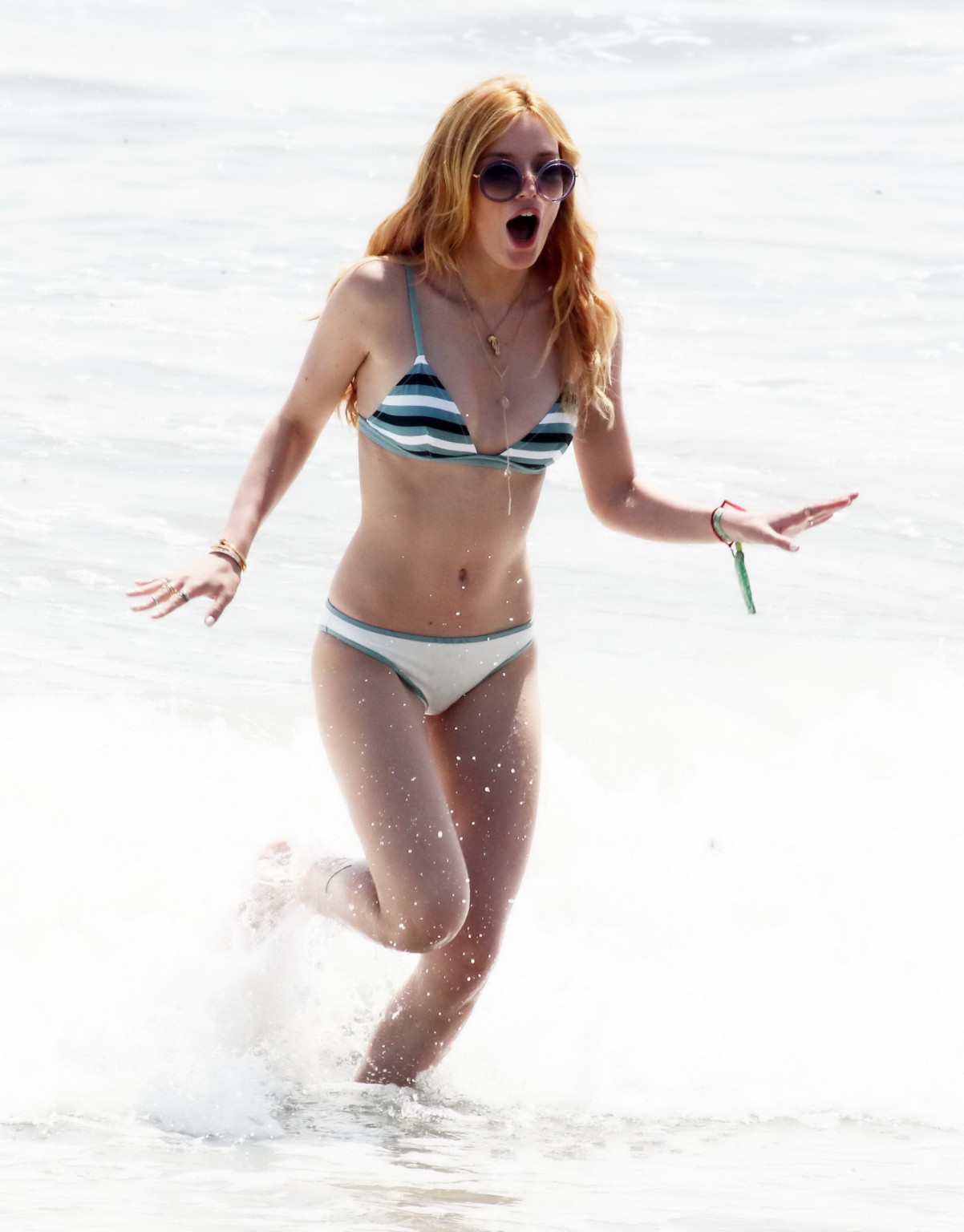 Bella Thorne stripping to bikini on the beach at Joel Silvers Memorial Day Party #75163109