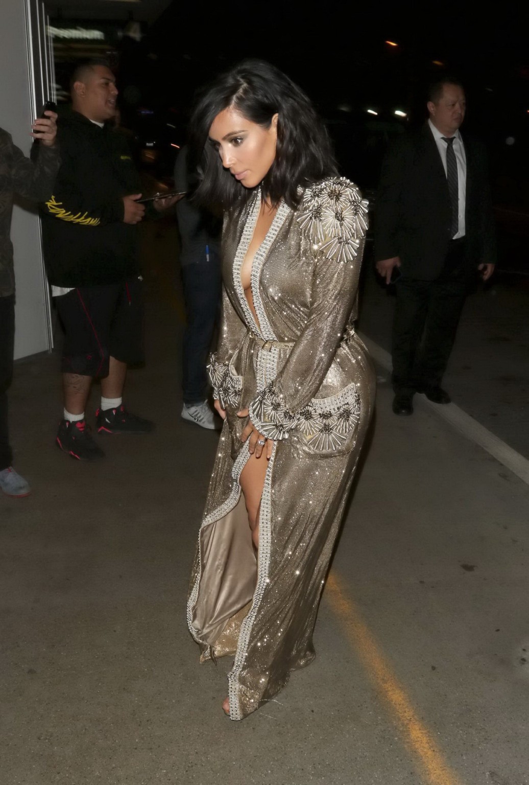 Kim Kardashian braless and pantyless in revealing golden smock arriving at 57th  #75173082