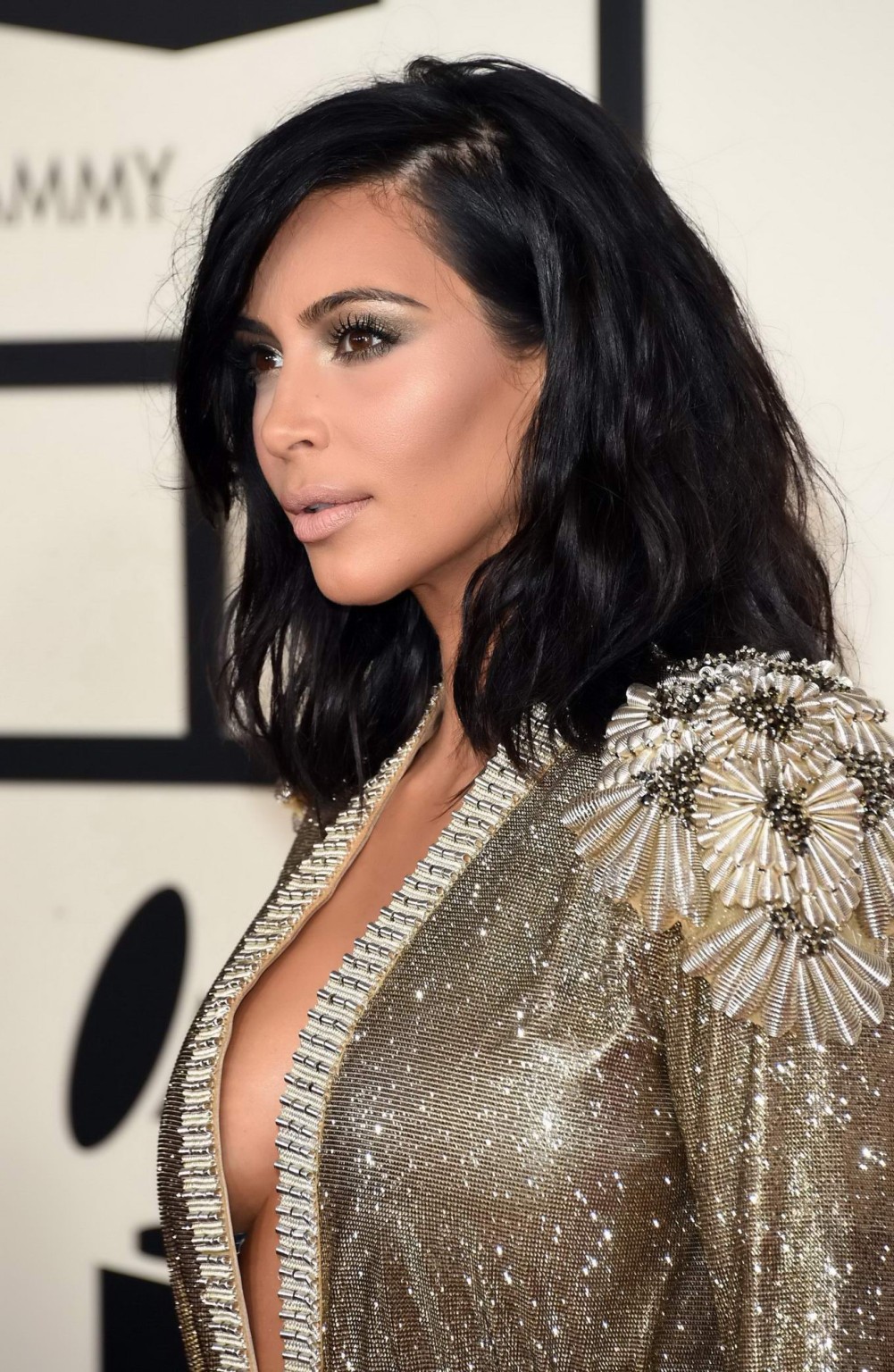Kim Kardashian braless and pantyless in revealing golden smock arriving at 57th  #75173152