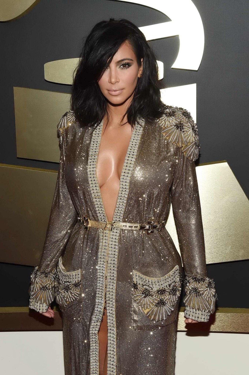 Kim Kardashian braless and pantyless in revealing golden smock arriving at 57th  #75173166