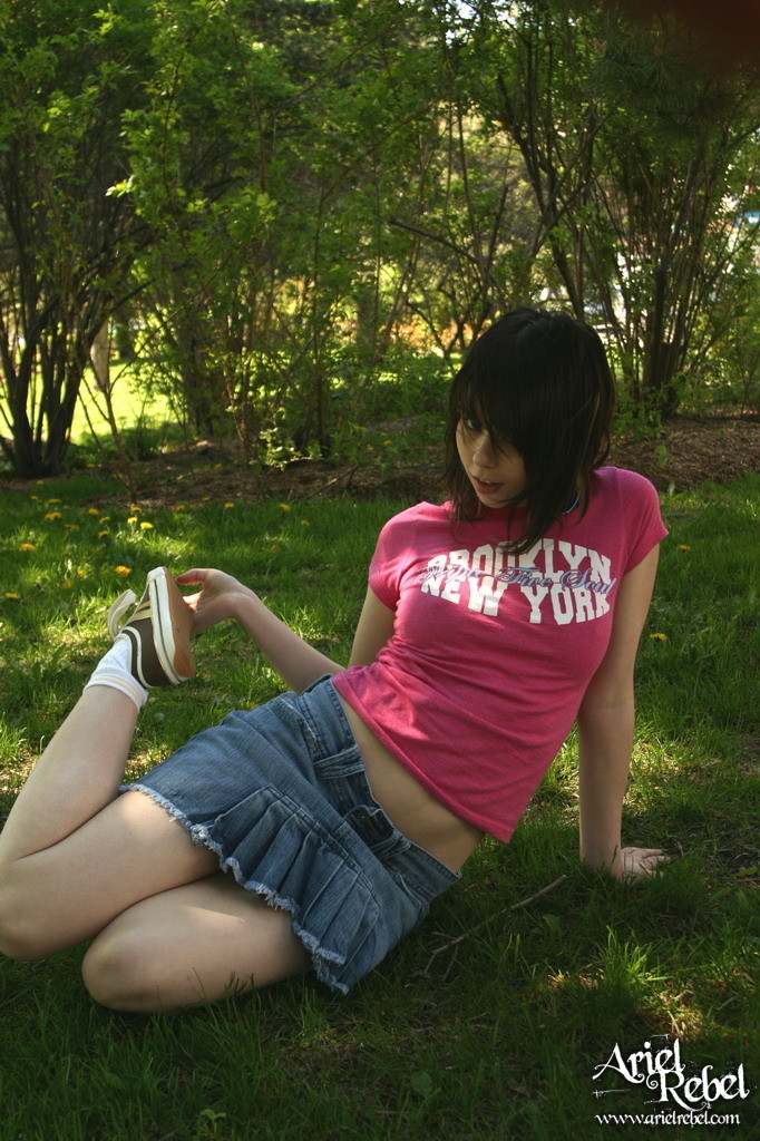 Teen in short skirt outdoors #67238180