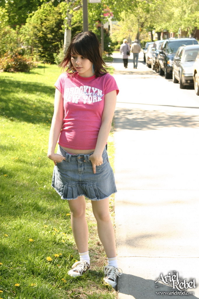 Teen in short skirt outdoors #67238218