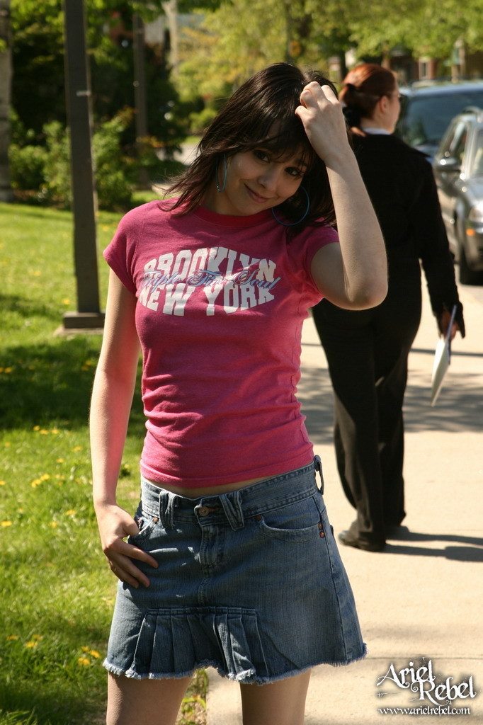 Teen in short skirt outdoors #67238224