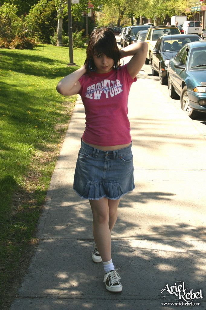 Teen in short skirt outdoors #67238231