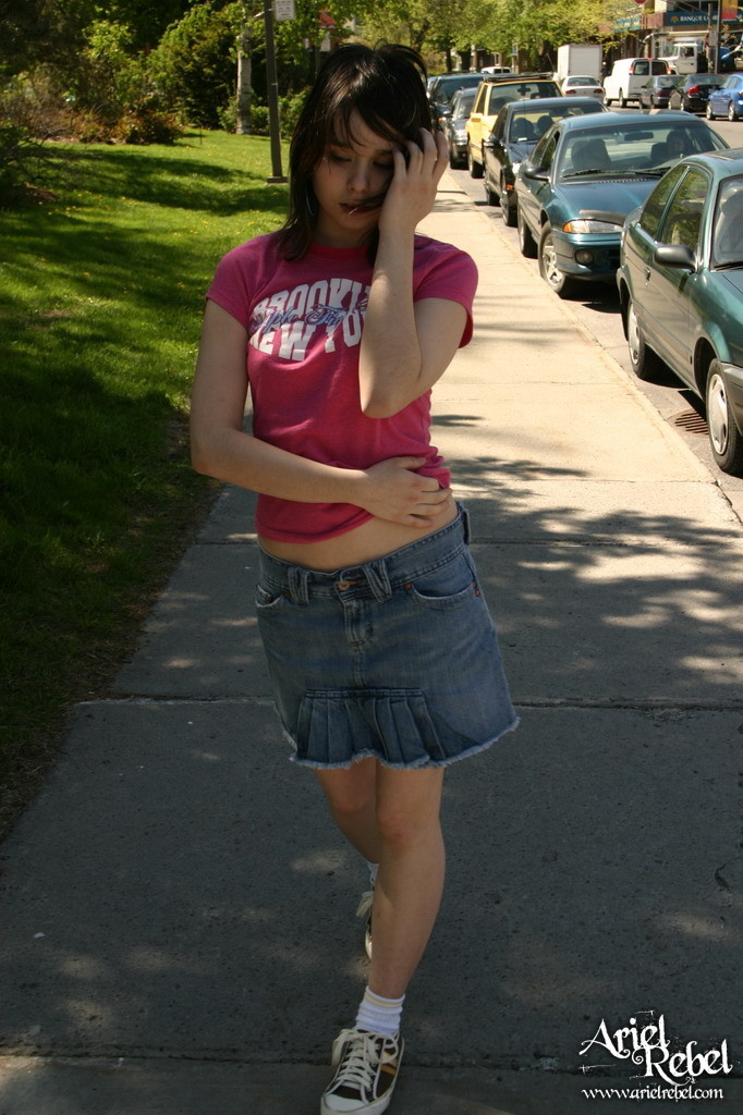 Teen in short skirt outdoors #67238238