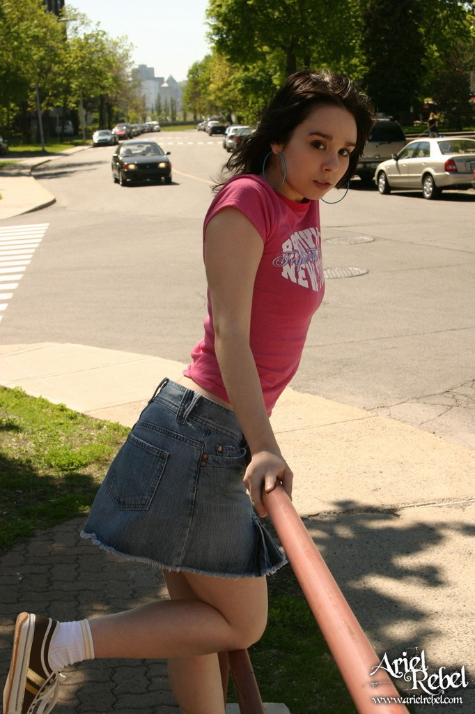 Teen in short skirt outdoors #67238252