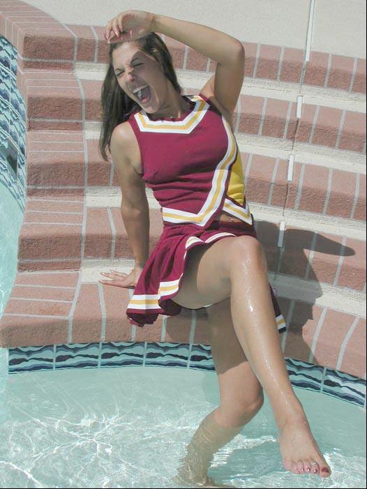 Pictures of a cheerleader swimming in her uniform #60578533