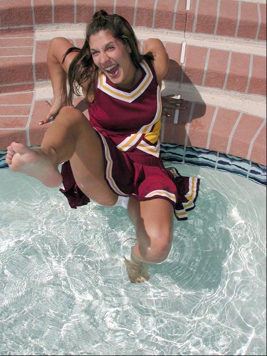 Pictures of a cheerleader swimming in her uniform #60578549