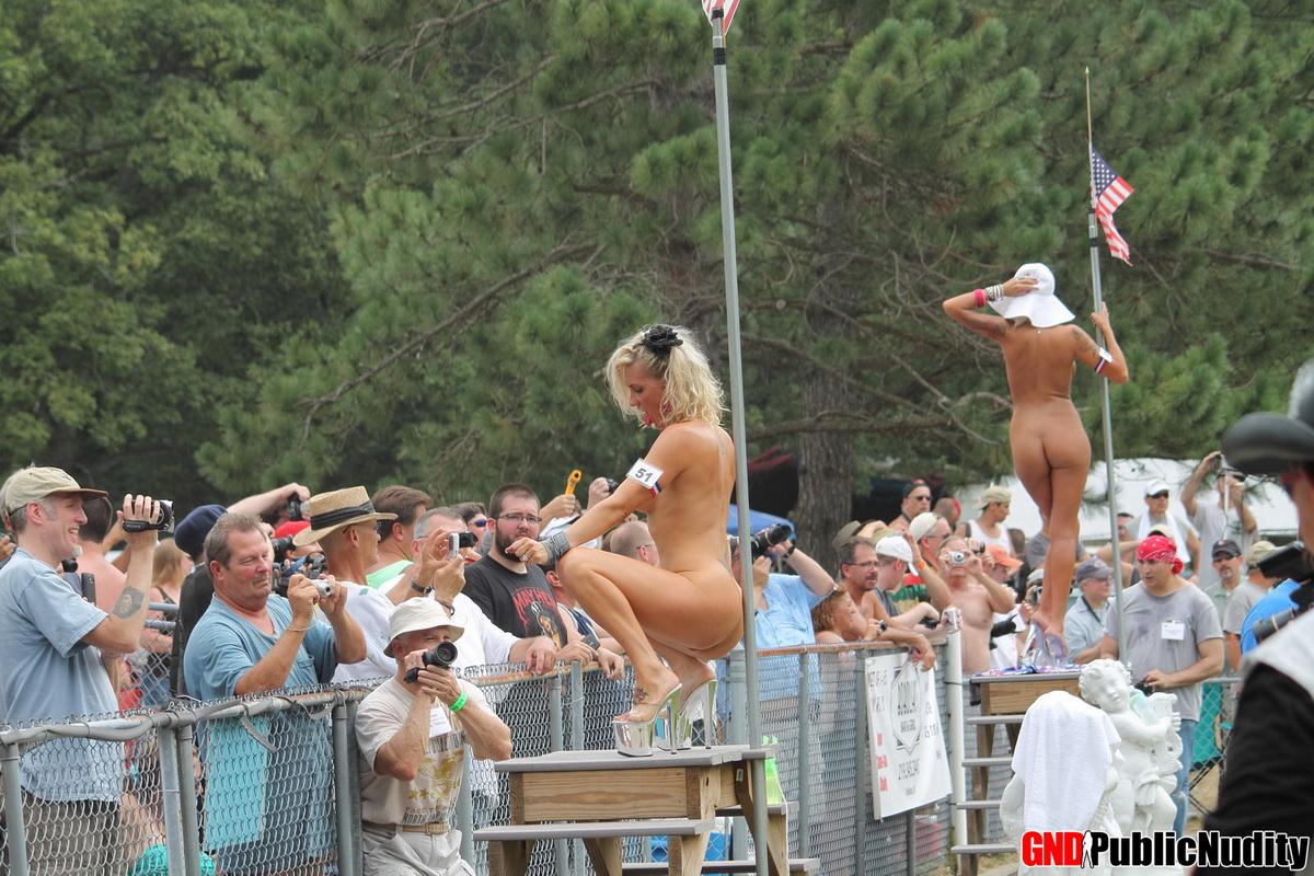 Hot strippers showing off for the people at an outdoor public nudity party #60506728