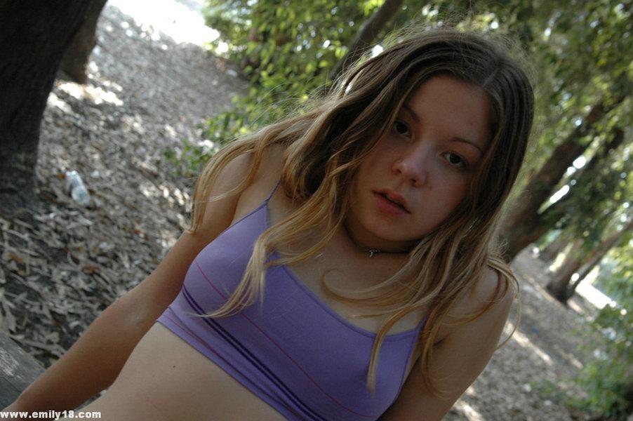 Pictures of Emily having some fun on a picnic table in the park #61766095