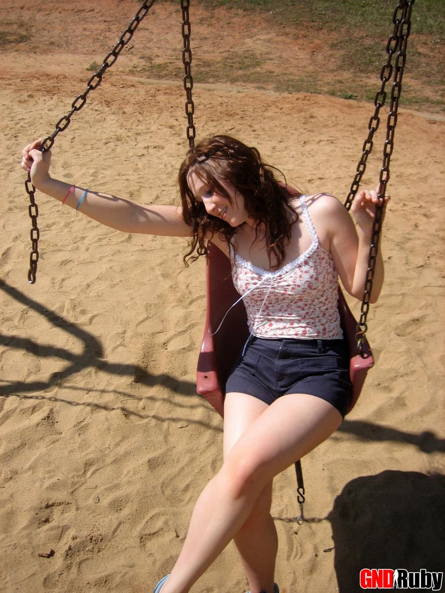 Red headed cock-tease Ruby plays on the swing set at the public park #59948457