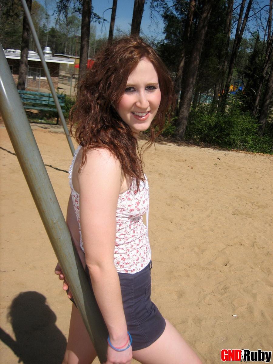 Red headed cock-tease Ruby plays on the swing set at the public park #59948487