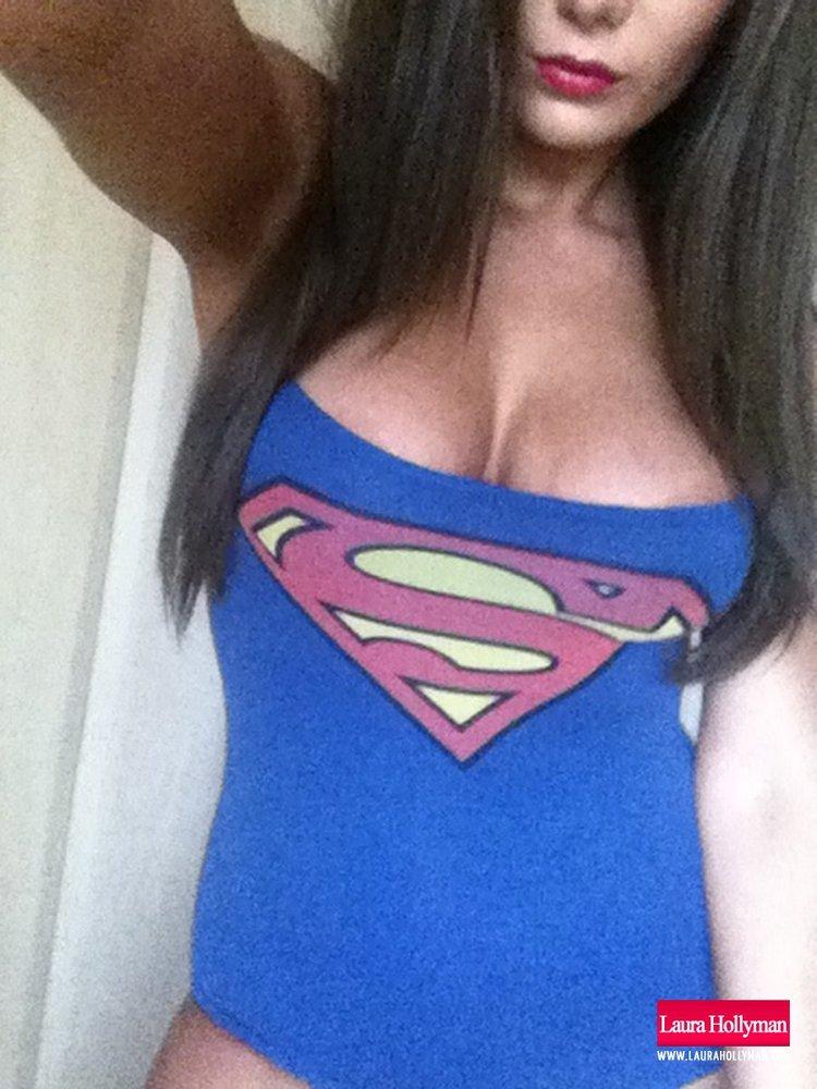 Laura Hollyman strips out of her sexy Supergirl top #58846945