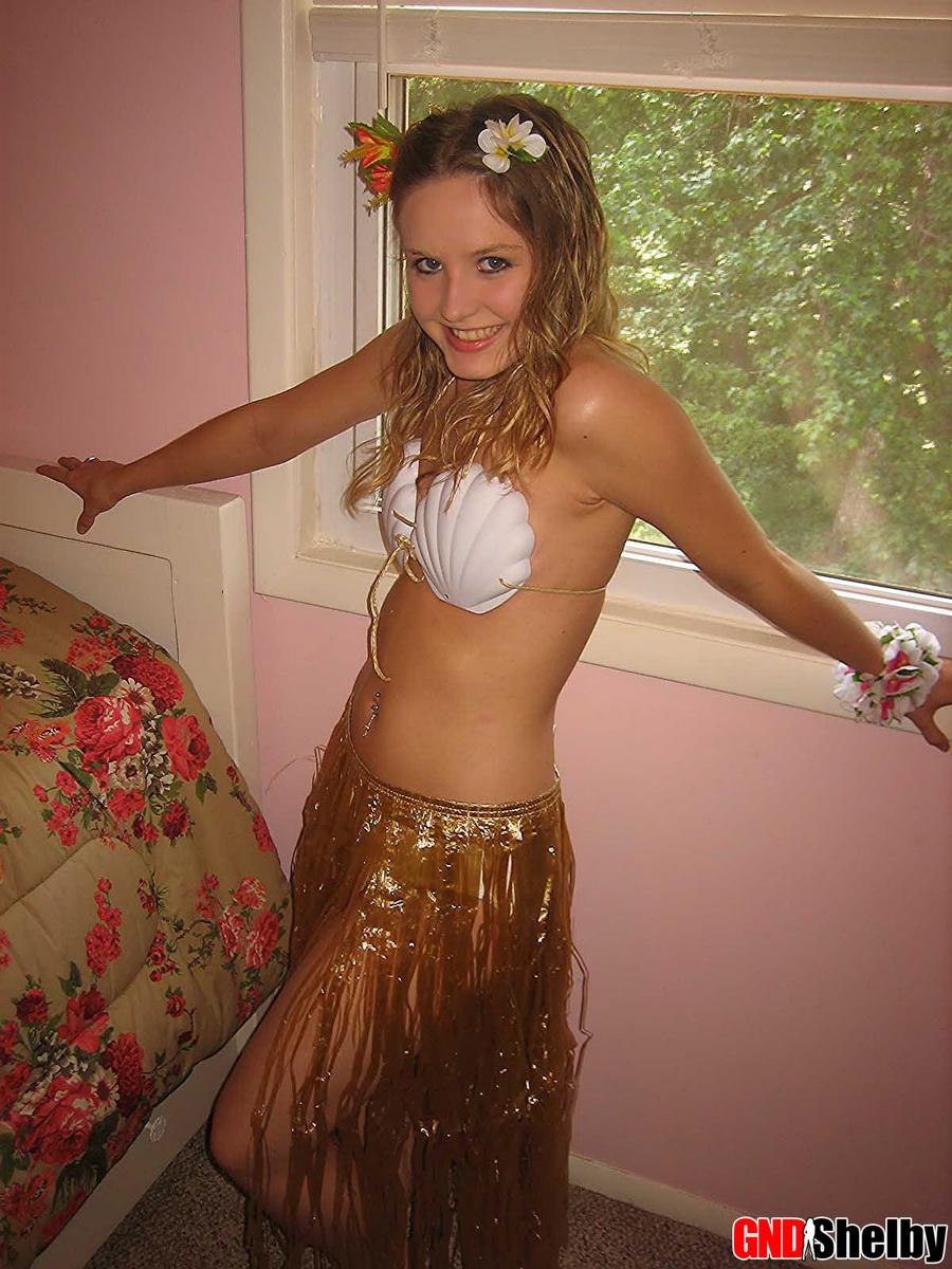 Petite teen Shelby strips out of her skimpy hula girl costume exposing her perky perfect tits #58761131