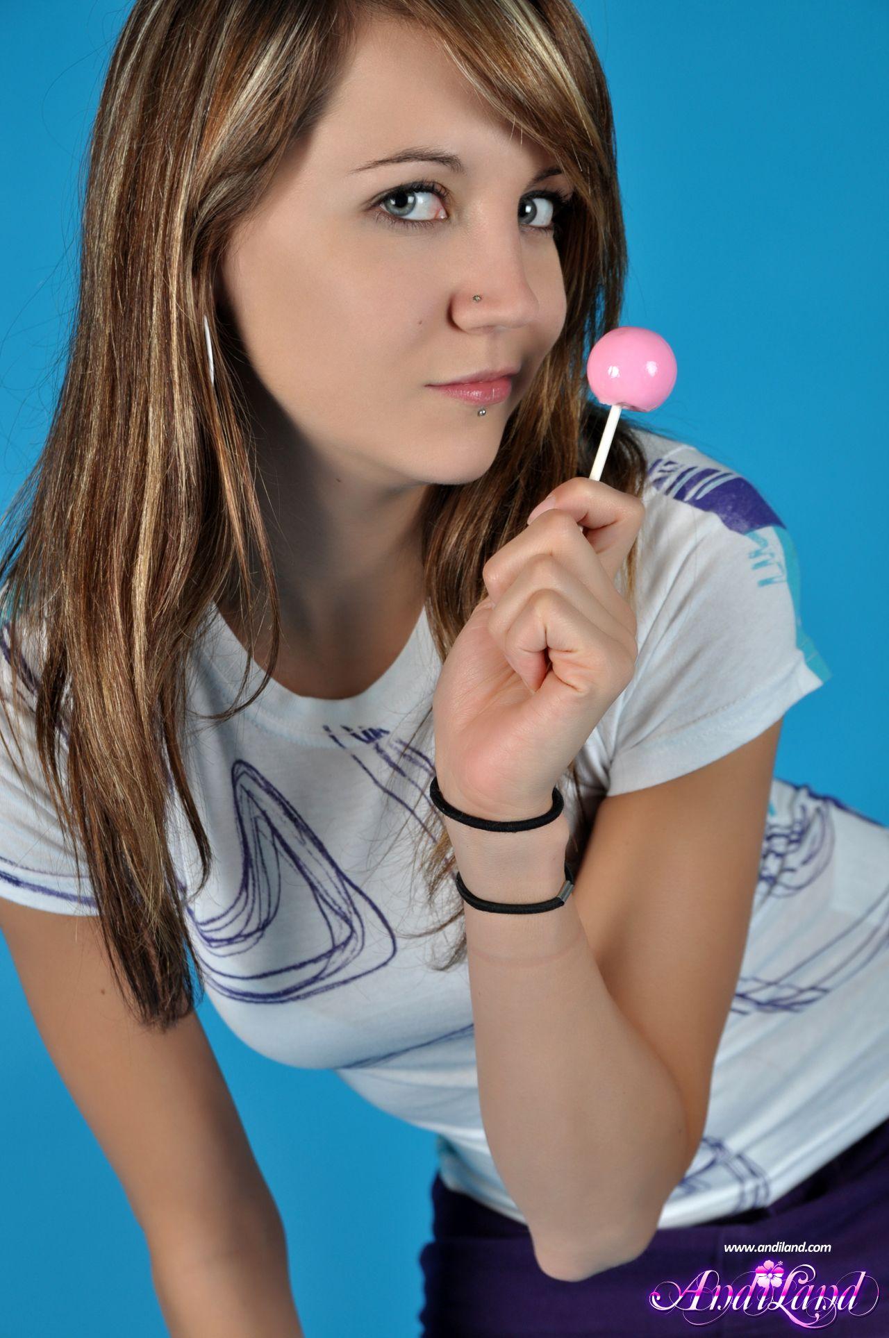 Pictures of Andi Land sucking on a lollipop
