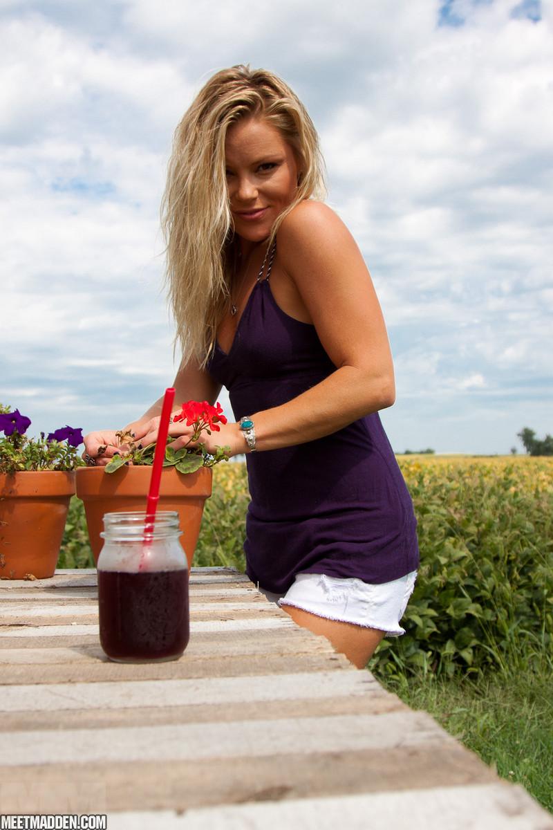 Blonde country girl Madden tends to her flowers outside #59451266