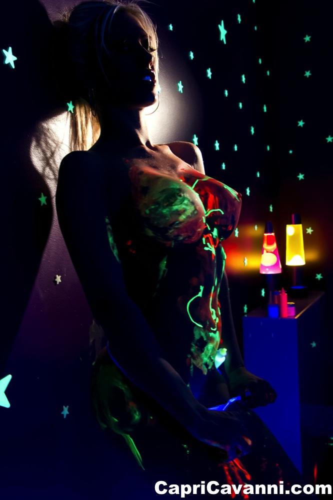 Busty babe Capri Cavalli strips under the glow of black light #53647095