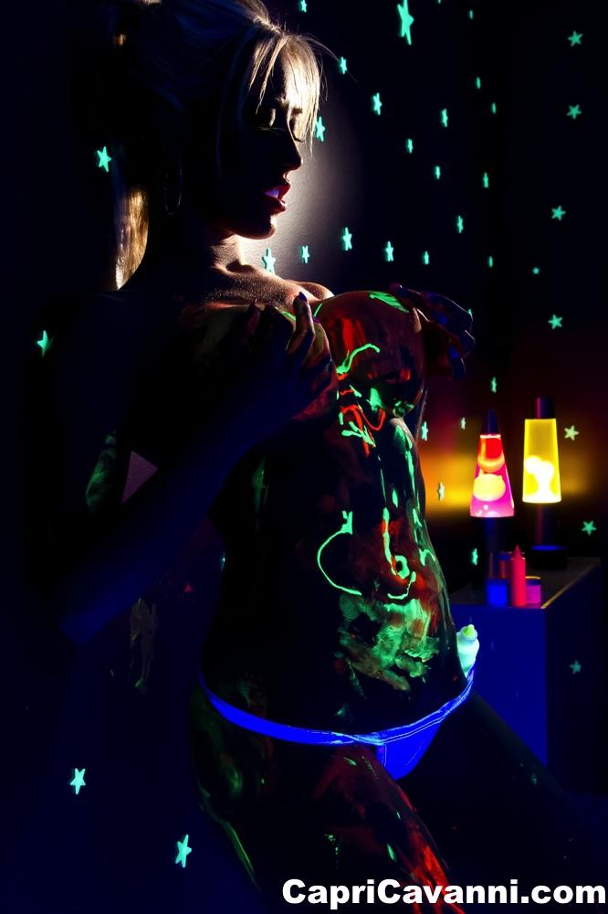 Busty babe Capri Cavalli strips under the glow of black light #53647120