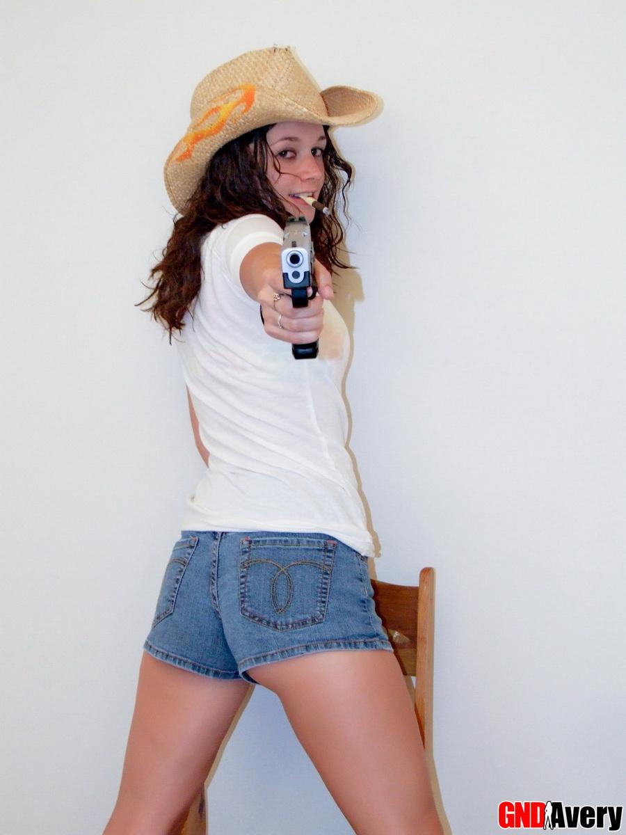 Sexy cowgirl Avery shows off her perky teenage tits as she strips naked holding a gun #54547749