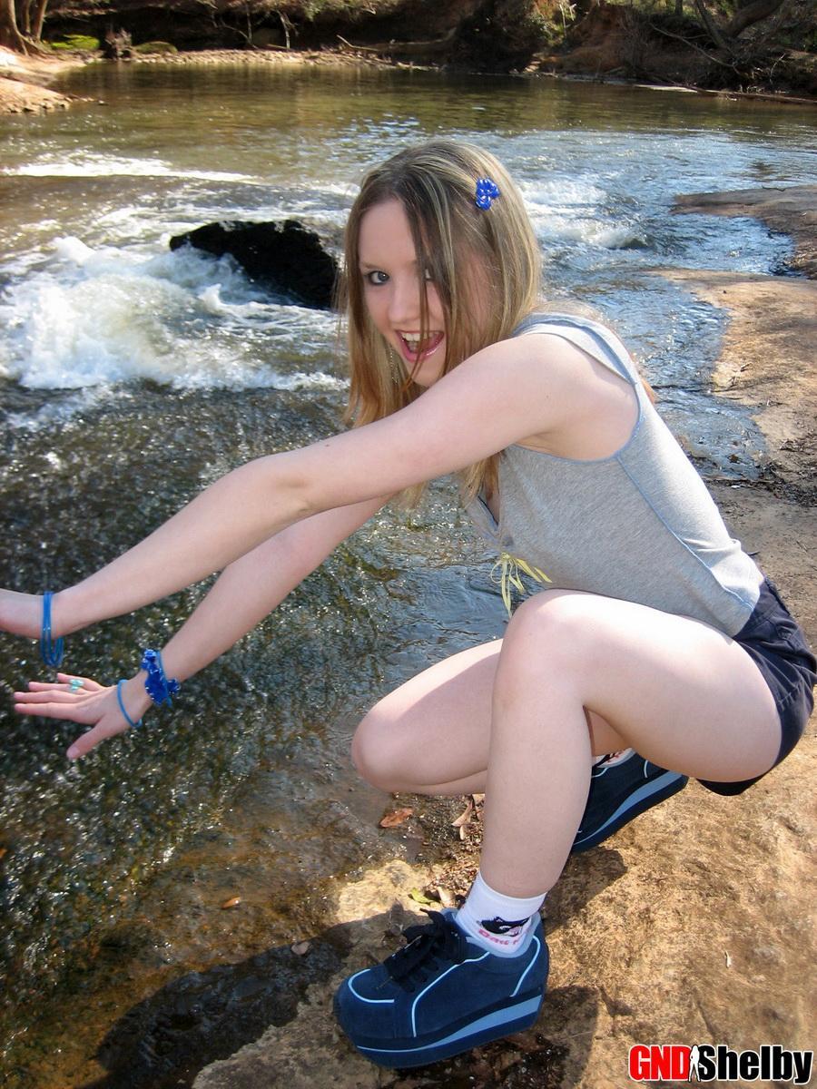 Cute teen Shelby flashes her perky tit while at the park down by the creek #58761867